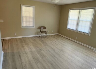 Unfurnished room with plenty of natural light and light wood-type flooring