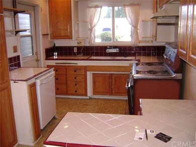 OAK CABINETS, TILE COUNTER TOPS