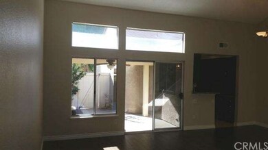 VIEW FROM ENTRY TO LIVING ROOM TO PRIVATE PATIO AR