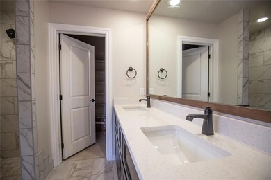 Bathroom featuring tile patterned flooring, a tile