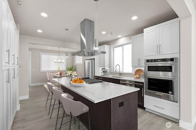 Virtual staging.  Thick slab quartz countertops, 5 burner gas range, two tone cabinetry with soft close cabinets and full height tile backsplash.