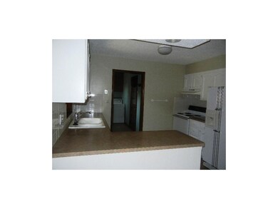 Laundry room is attached to kitchen.