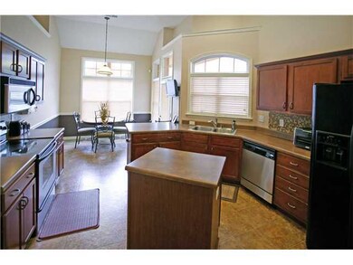 THe kitchen has SS appliances, a breakfast bar, an