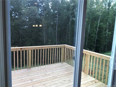 Wooded Back yard with deck off of breakfast area