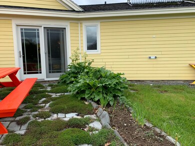 Mature landscaping around patio