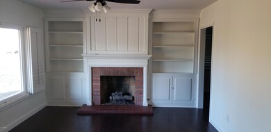 LR with Fireplace flanked by bookcases