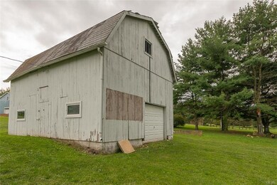 Detached unfinished barn could be used as a garage