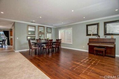 Gorgeously upgraded with rich wood and tile floors