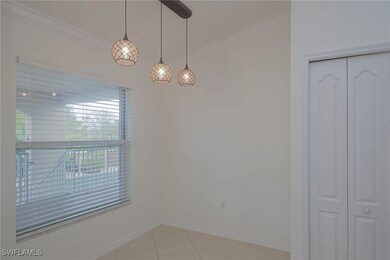 Empty room featuring ornamental molding, light til