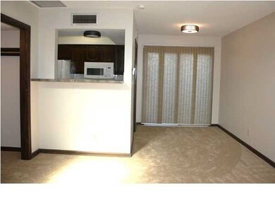 View from living room into the kitchen and diing