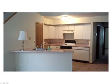 White kitchen with new flooring.