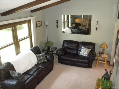 Living room with vaulted ceilings.