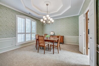 Dining Room with large windows and high cove ceili