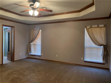 Large master bedroom with lots of crown molding. R