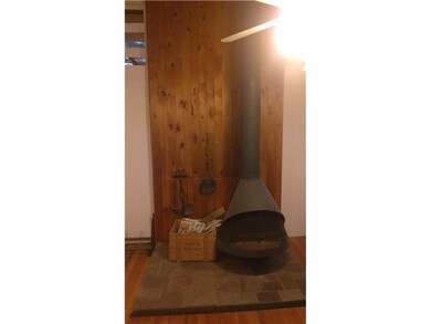 Living Room. with wood stove on hearth