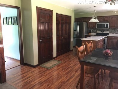 KITCHEN WITH ISLAND AND PANTRY CUPBOARD