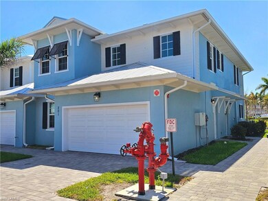View of front of property featuring a garage, stuc