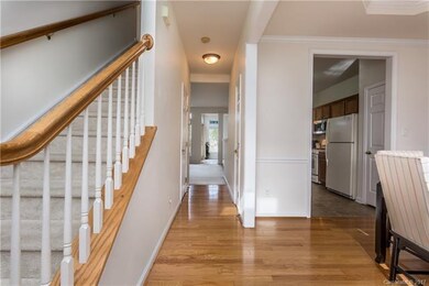 Walk in to entry hallway and elegant dining room.
