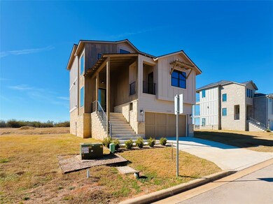 View of front of home featuring a garage and a front lawn