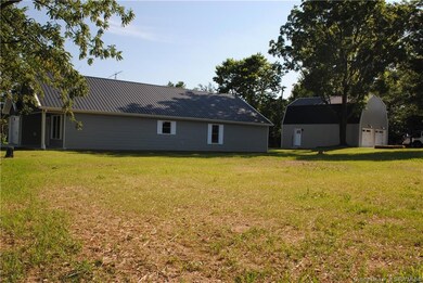 Corner lot now included with sale