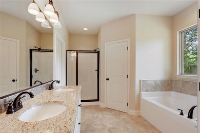 Master Bath with separate soaker tub and shower wi