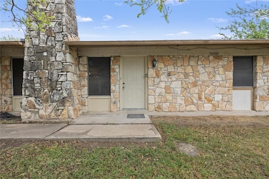 Doorway to property with stone siding