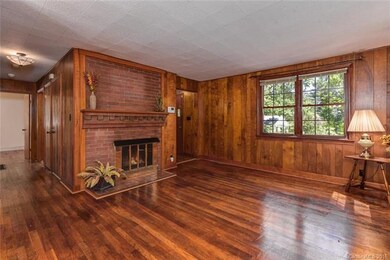 Spacious Living Room With Wood Floors And Gas Fire