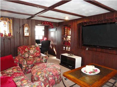 Living room has space for flat screen.