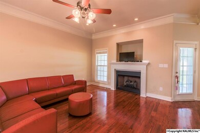 You will enjoy your time in this huge family room with nice cozy fireplace and gleaming hardwood floors