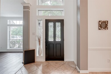 Spacious entrance area and fresh paint for the front door in matte black