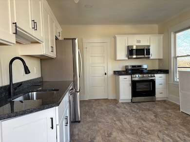 This brand new kitchen offers white shaker cabinet