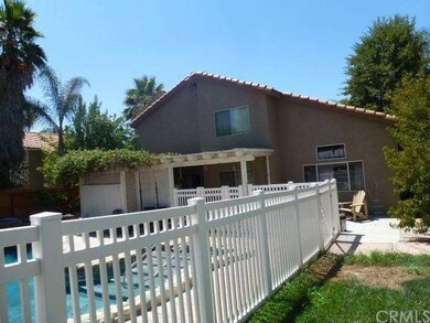 Rear of home with covered patio area and covered s