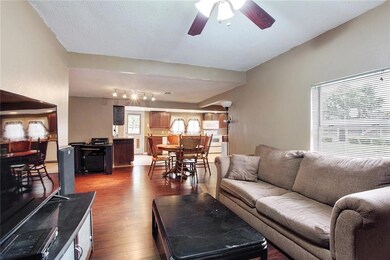 Living room is open to dining and kitchen.