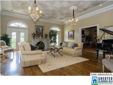 The Living Room features a soaring decorative ceil