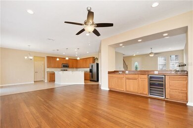 Wet bar with sink and wine cooler.