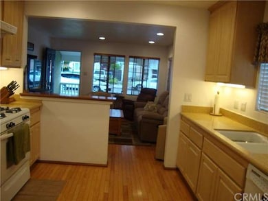 Kitchen looking towards light and open living room