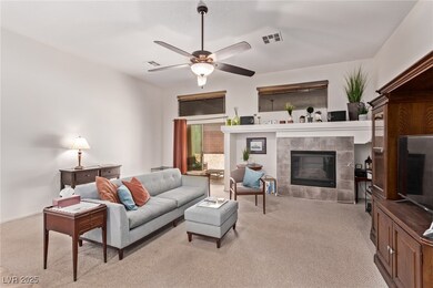 Living area with light colored carpet, a tiled fir