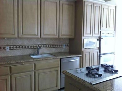 Prep sink, double dishwashers, stove top, double o