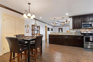 Kitchen and Dining open to living room. Laundry ro