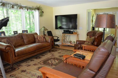 Family room with gleaming wood floors.