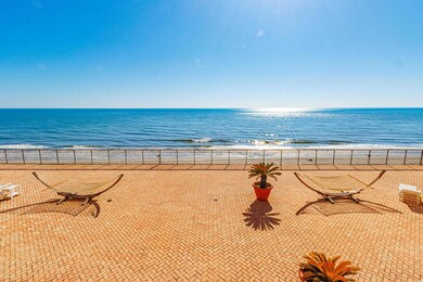 Property view of water with a beach view