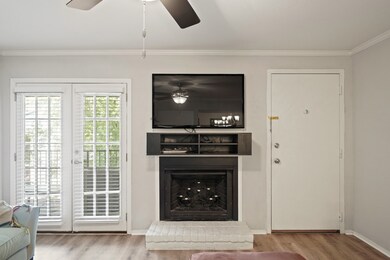 The wood burning fireplace has a mantle.