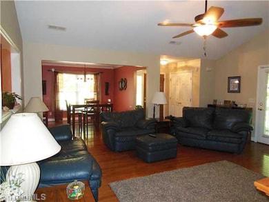 Living Room. Living Room open to Dining Room with Wood Flooring