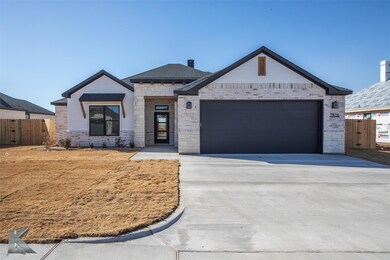 View of front facade featuring a garage