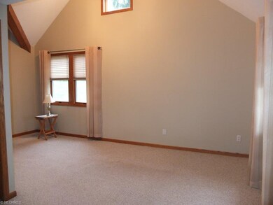 Another view of the 2 story living room.