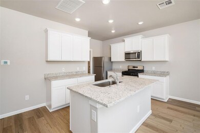 his spacious island is perfect for meal prep, casu