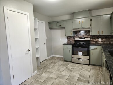 Pantry with adjacent pot shelves.