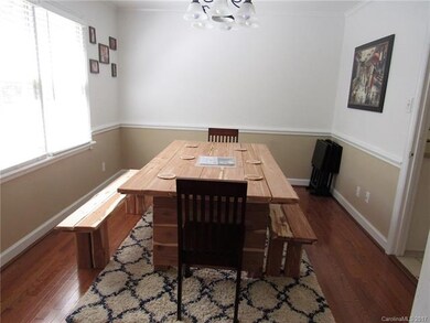 Spacious dining room with gleaming hardwood floors
