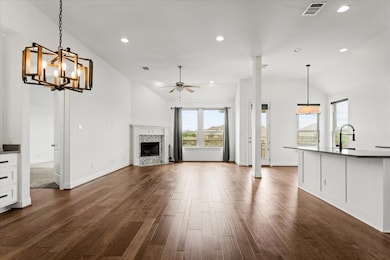 Unfurnished living room with dark wood-style floo