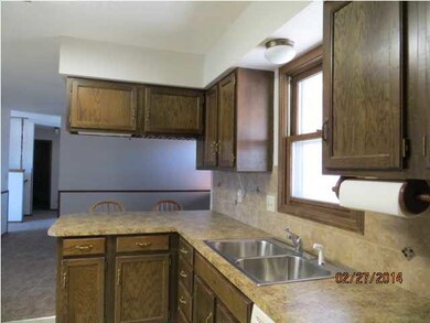 Kitchen opens to FR/Hearth room with FP